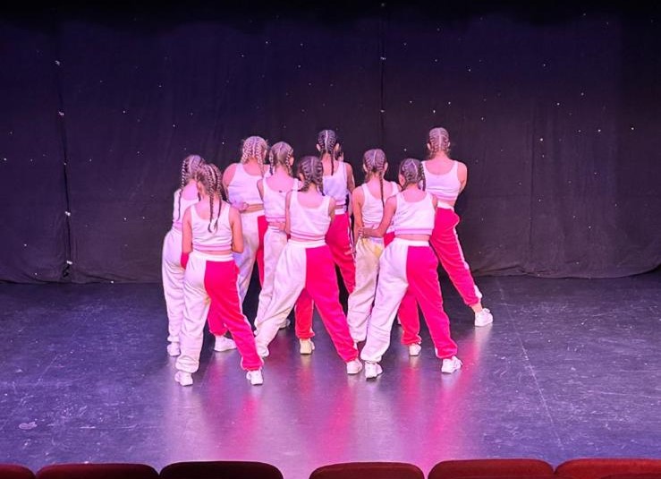 Smiling tap students mid-routine at Clairemarie’s School of Dance